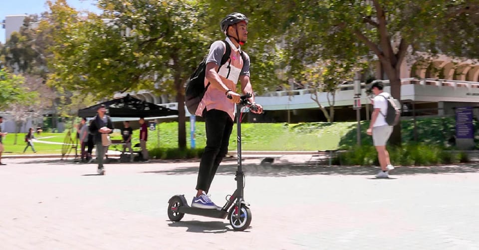 e-Scooter Step Kickstart Guided Tour: Sightseeing Maspalomas - Meloneras volcanic black sand and the local bar stop