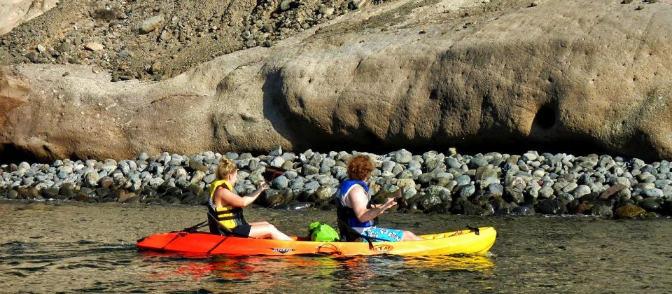 Gran Canaria: South Coast Guided Kayaking Trip - Paddling Out Through Rocks Toward Los Militares