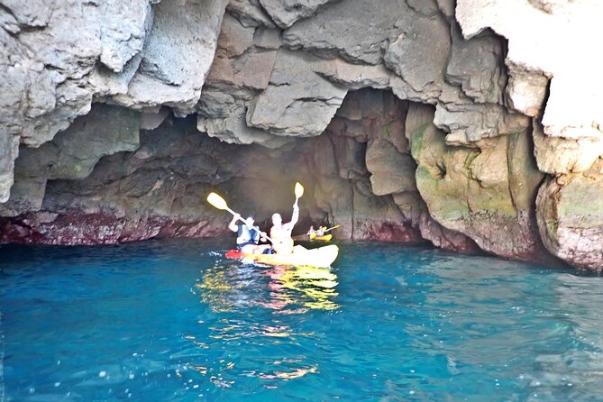Kayak & Snorkeling Tour in Caves in Mogan - Cliff jumps (optional) and snorkeling on an unspoiled beach